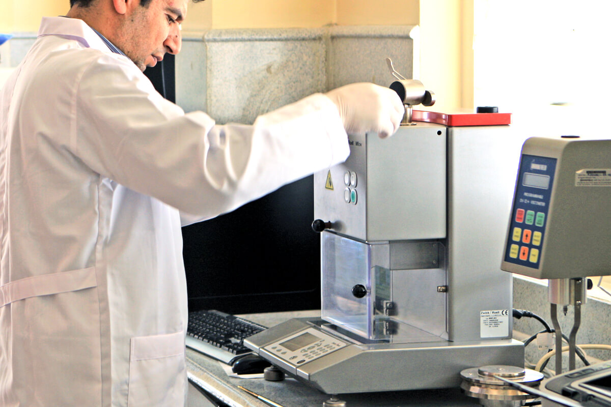 Technician performing sample analysis in lab