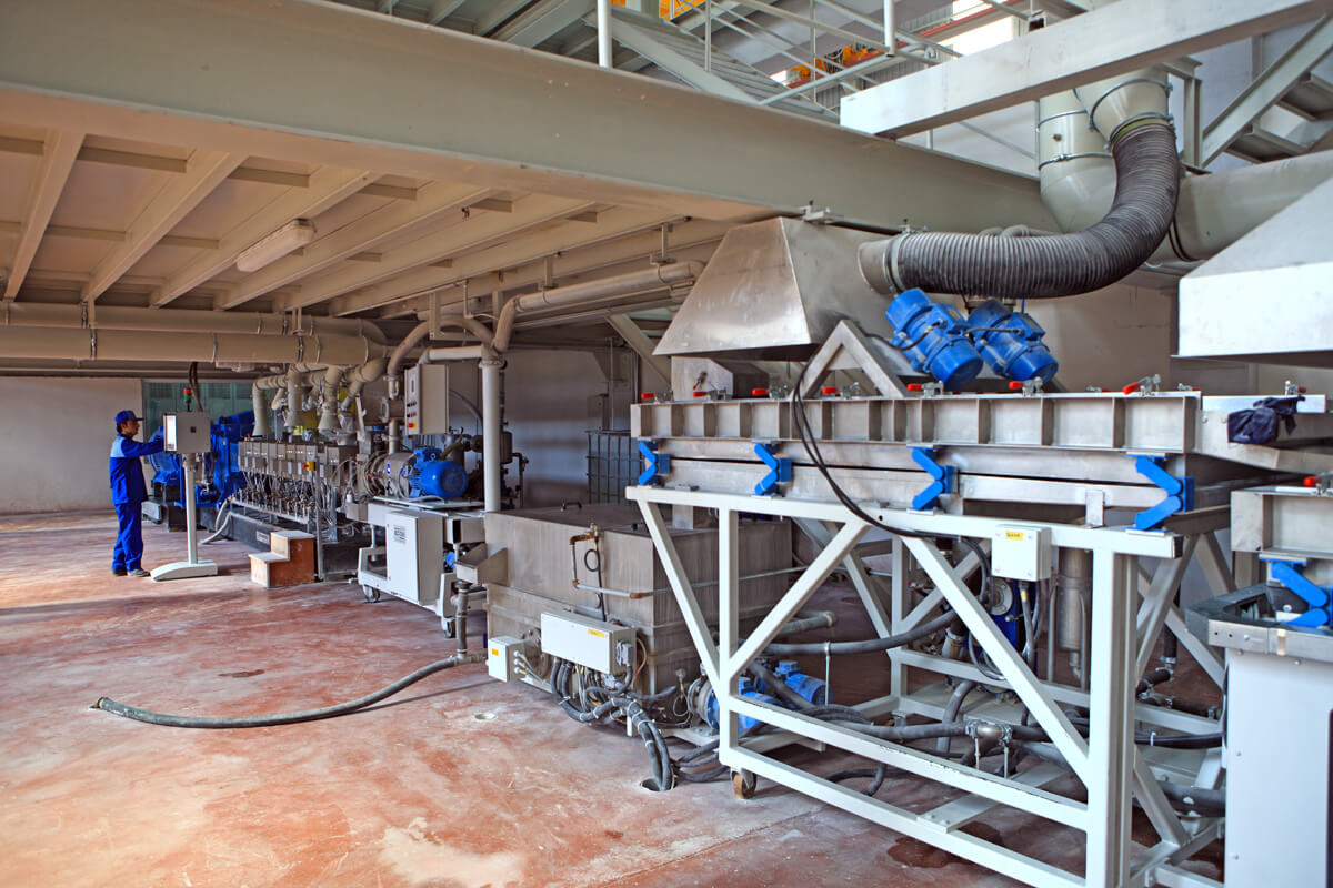 Machinery and operator working on production line